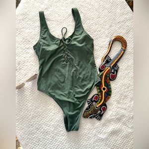 Green, one piece lace up swimsuit NWOT